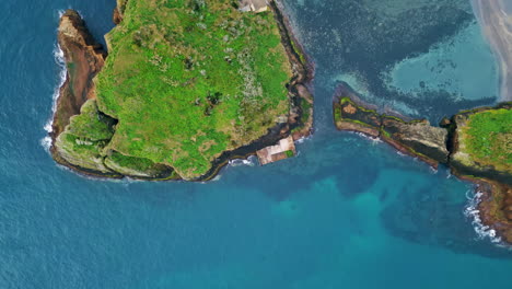 aerial ocean cliffs coastline view. turquoise ocean washing serene seashore