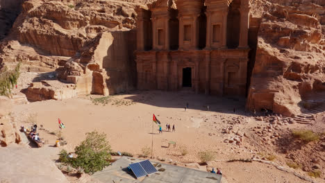 Top-down-reveal-shot-of-the-ancient-ruins-of-The-Monastery-in-Petra