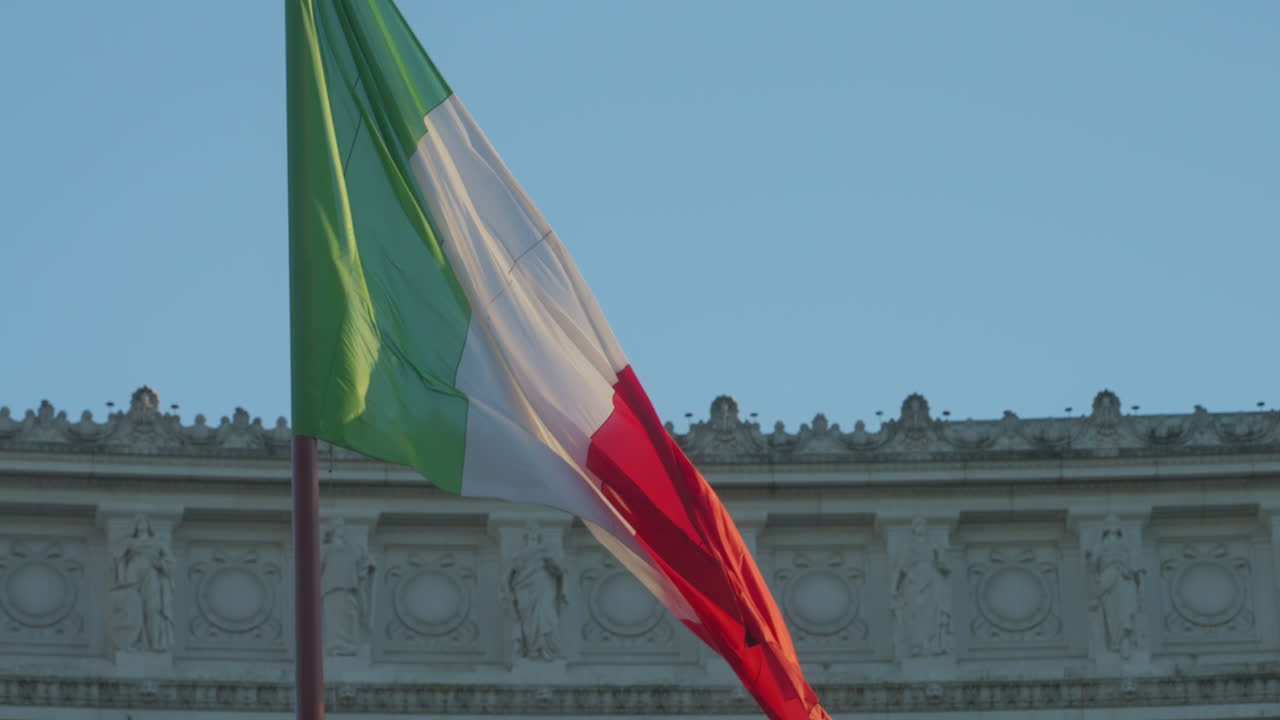 Italian flag at Monumento Vittorio Emanuele II waving in slow motion