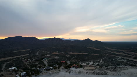 Drone-shot-in-reverse-at-sunset-of-ensenada-de-los-muertos-beach-in-mexico