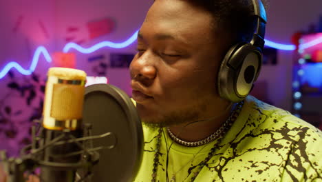 man recording music in a home studio