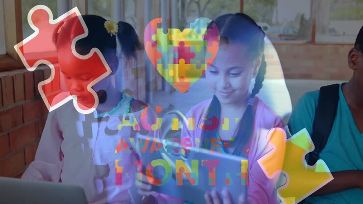 Animation of puzzle and autism awareness month text over diverse schoolchildren using tablet