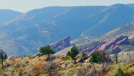 mountain biking bike sport fitness red rocks amphitheater morrison golden colorado aerial drone parallax circle left dakota ridge trail denver green mountain foothills front range adult male biker day