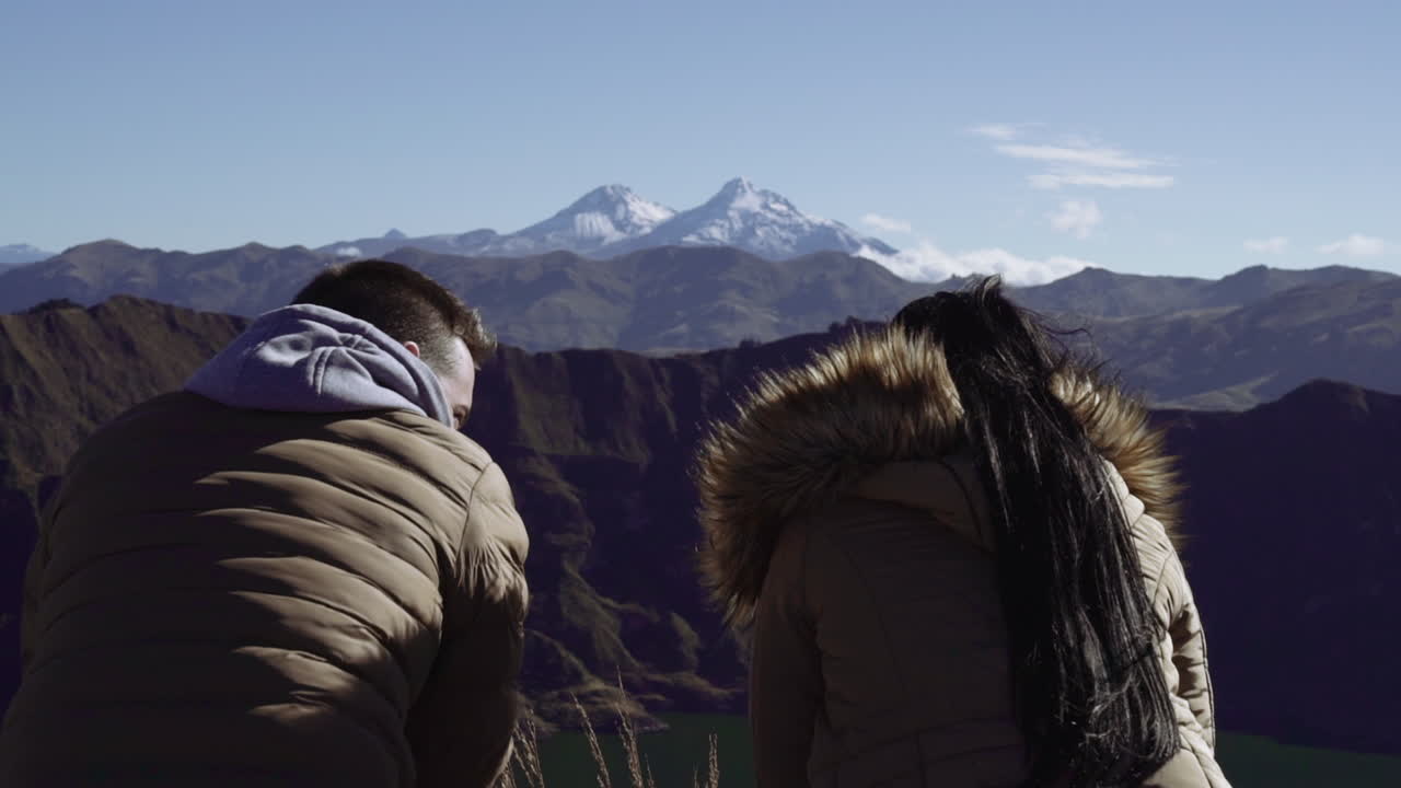 Couple enjoying breathtaking mountain view