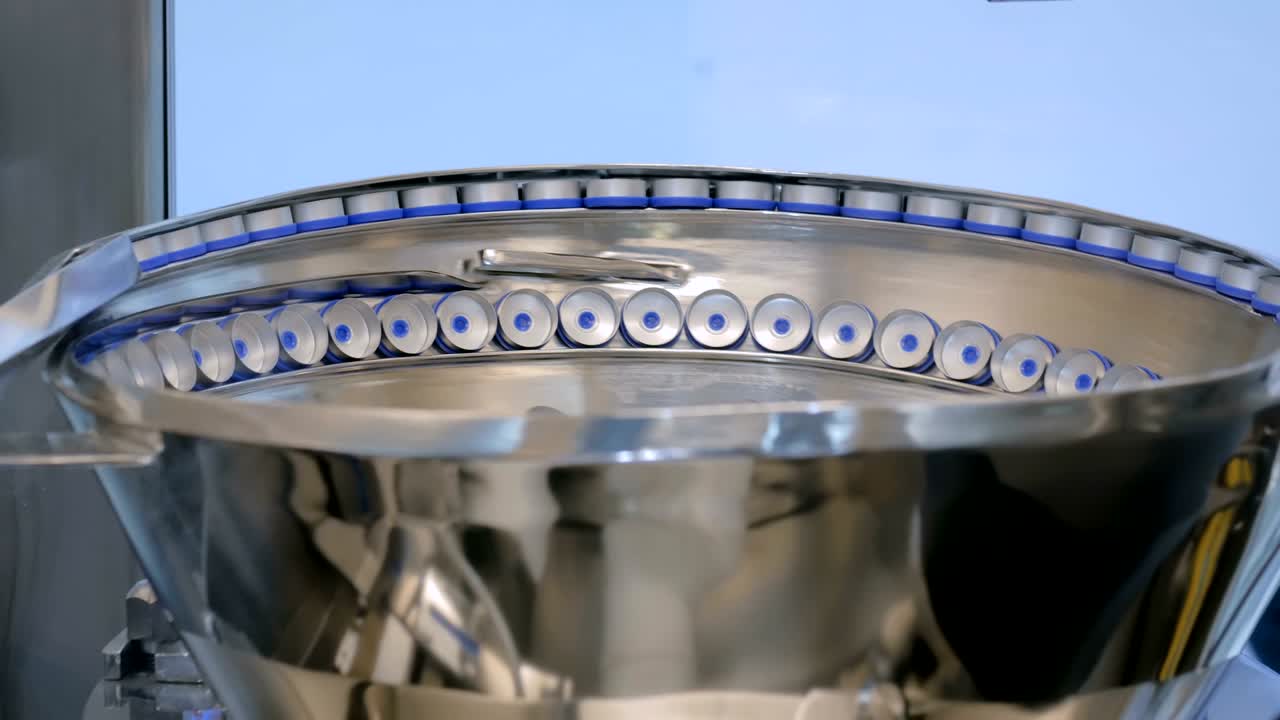 línea de producción farmacéutica - sistema de transporte para tapones de botellas de plástico