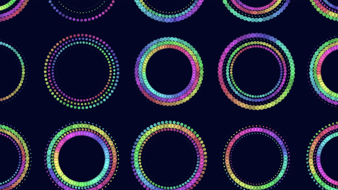 An aesthetically pleasing display of circles in blue, purple, and pink hues arranged in a circular pattern against a black background