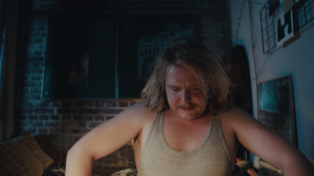 Man Smoking in a Dark Room