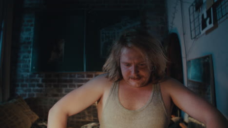 man smoking in a dark room