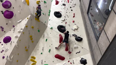 2 people pursuing a 25 metre wall