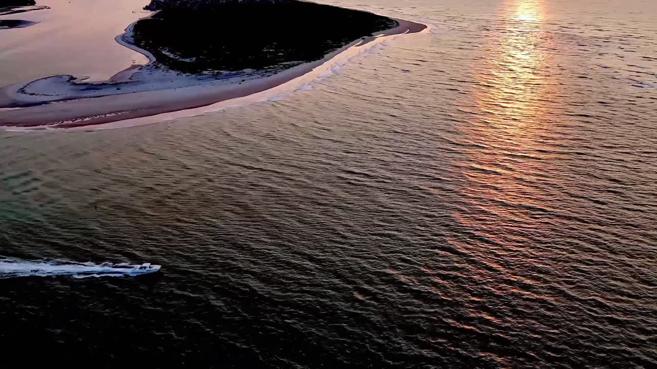 Boating through New Topsail Inlet at sunrise