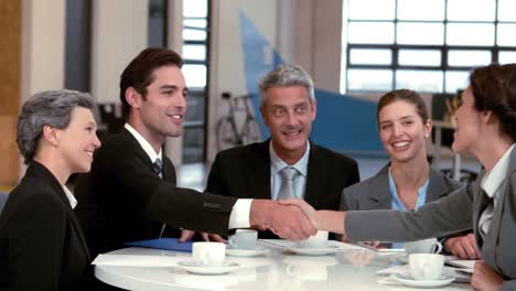 business couple handshaking