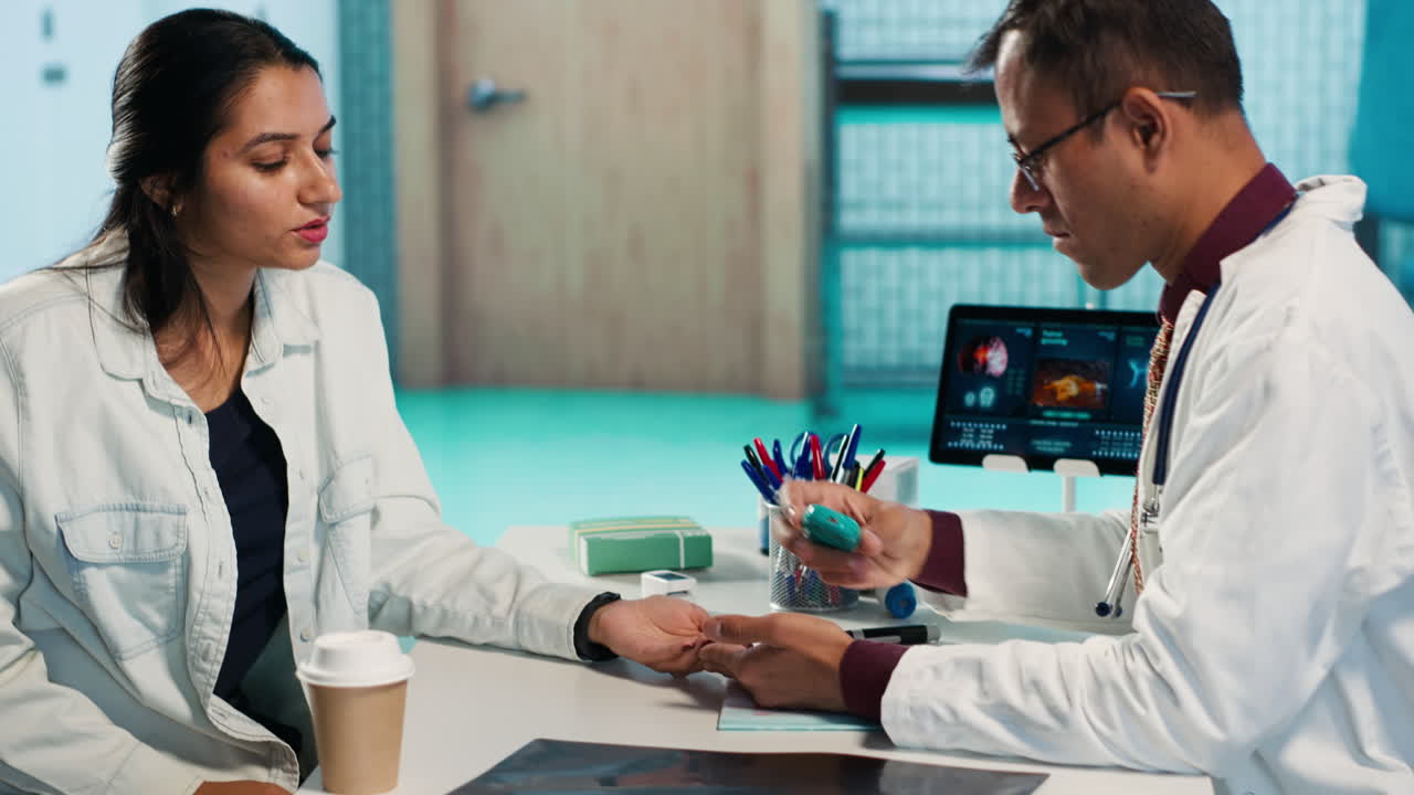 Medical consultation with doctor examining patient using pulse oximeter