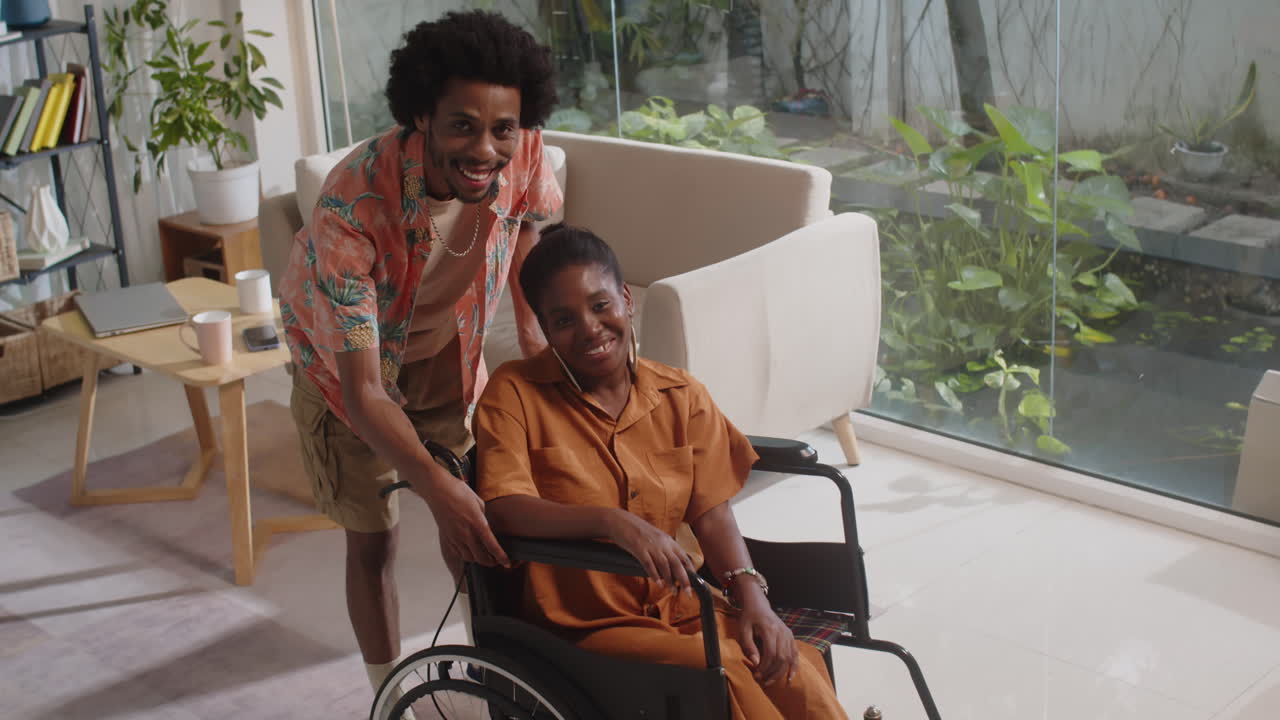Portrait of Cheerful Woman in Wheelchair and Her Boyfriend