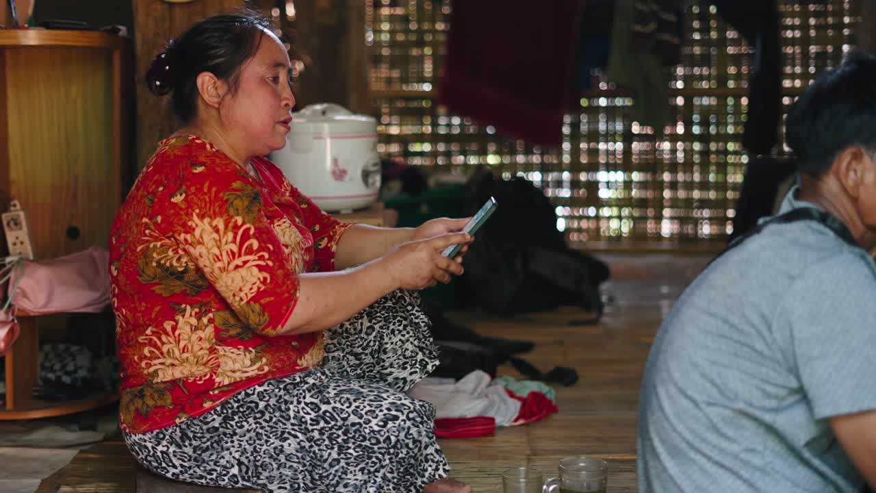 A woman using a mobile phone indoors