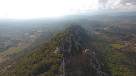 pic saint-loup edge summit by drone. cliff with valleys around aerial view