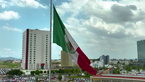 slow-motion drone orbit around the mexican flag