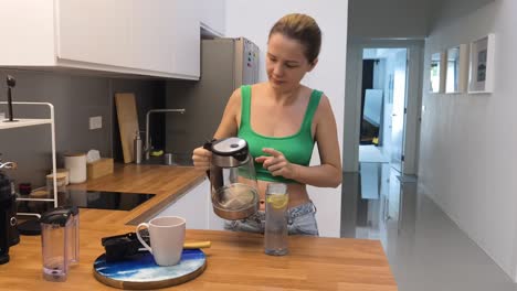 woman preparing drinks in the morning kitchen