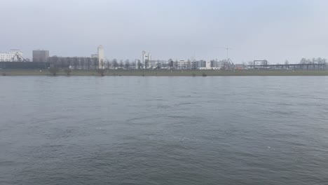 view of the rhein on a foggy morning in cologne, germany.
