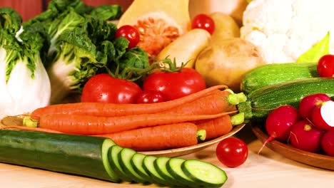 assorted vegetables displayed on a wooden surface