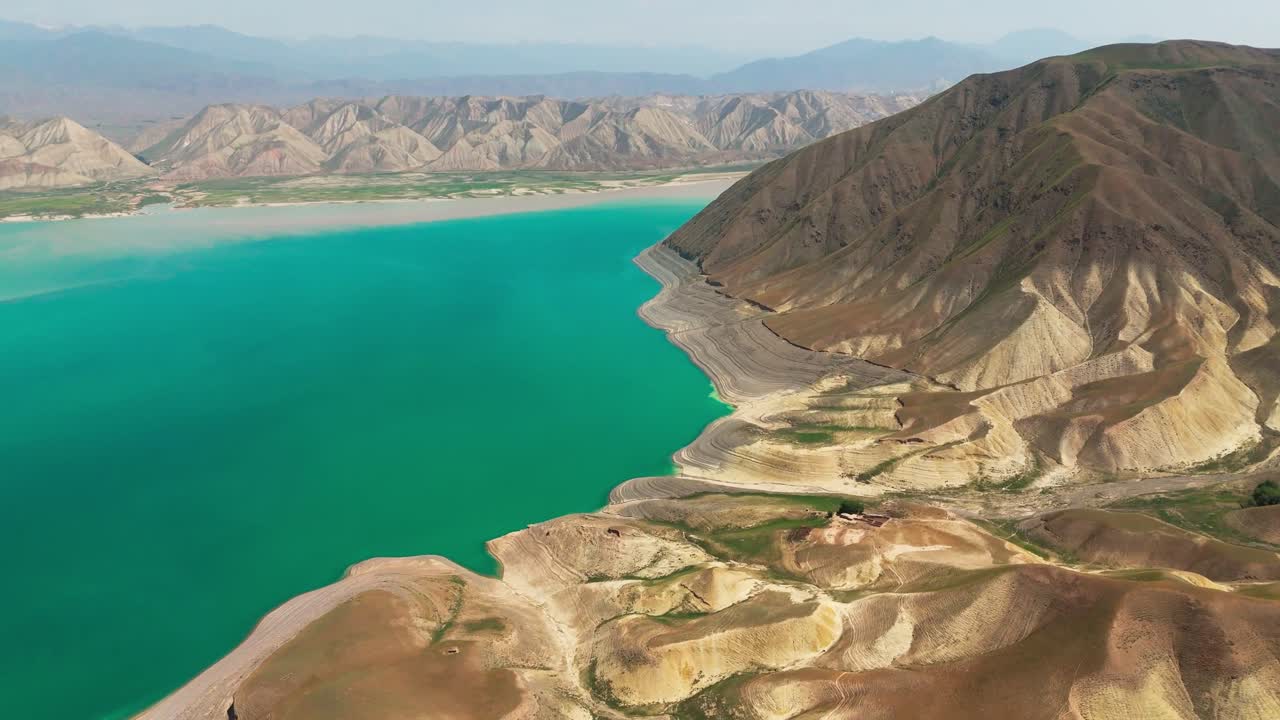 Aerial scenic footage of Kyrgyzstan Toktogul lake largest water reservoir in Kyrgyz Republic and Central Asia