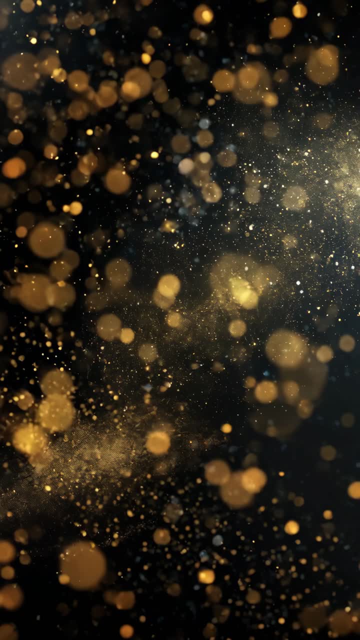 A mesmerizing video concept with golden bokeh lights on a dark ...