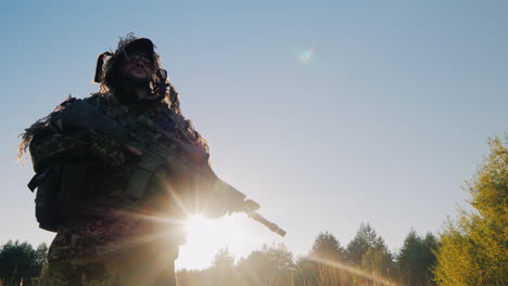 The-Soldier-In-The-American-Ammunition-Worth-Against-The-Sky-The-Sun-Shines-On-His-Arms-Lower-Angle