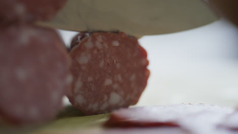 cutting salami into slices