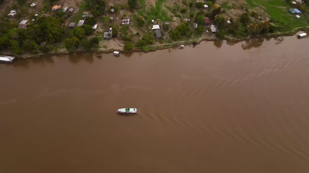 Aerial view of Manaus Brazil, Amazon River, Ship Sails at Rain forest coastal landscape