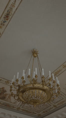 ornate gold chandelier in a historical palace