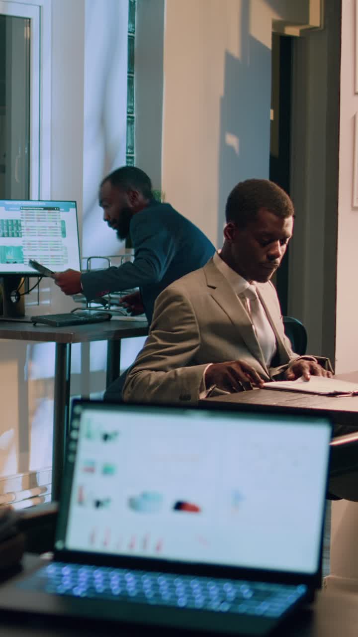 Vertical video Employees auditing payroll reports