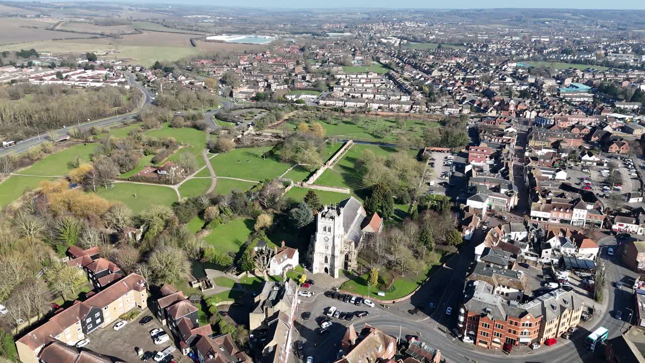 Waltham Abbey town Essex UK pull back drone aerial reverse reveal