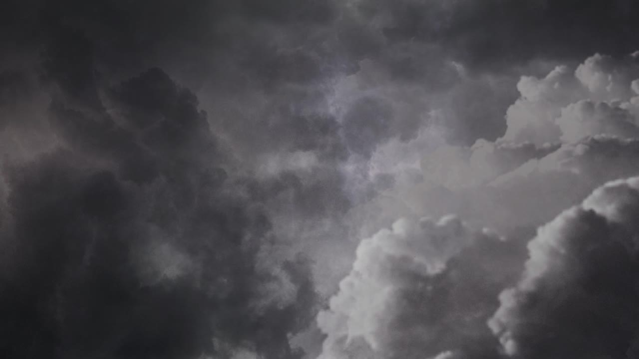 View of dark clouds and thunderstorm inside dark sky