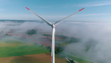 wind turbine turning in a field aerial