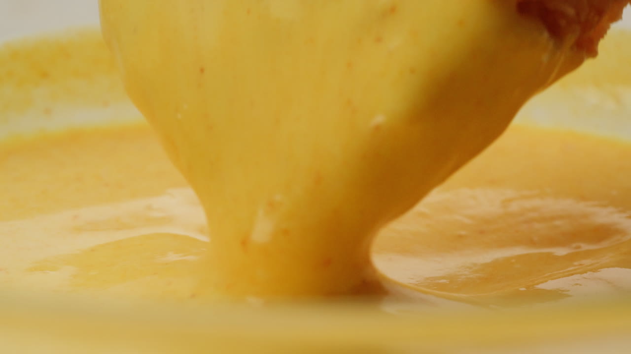 Bread Dipping into Curry Soup