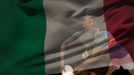 rugby player throwing ball and getting tackled with italian flag