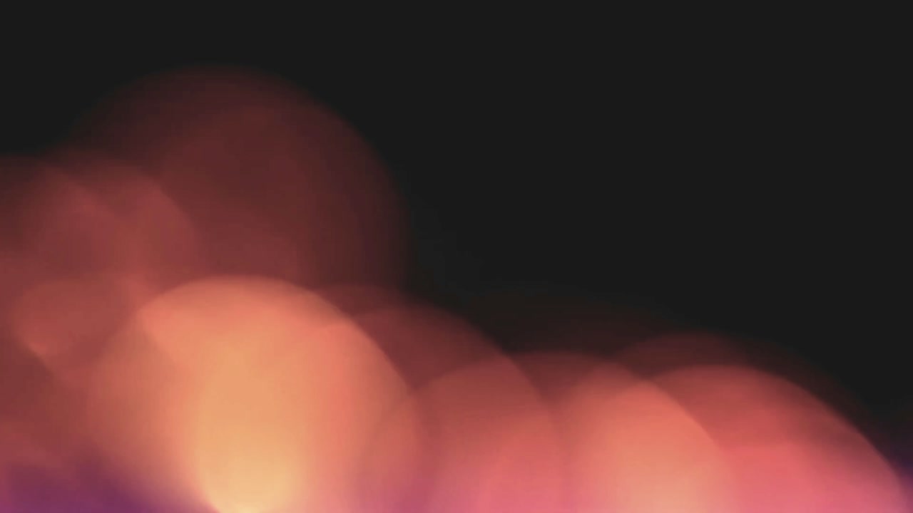 Vazamentos de Luz Bokeh Suaves em Laranja e Roxo em Fundo Escuro