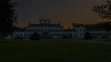 beautiful time lapse of soestdijk palace with the sun rising behind the structure