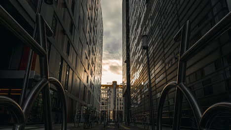 bike racks at the barcode district in oslo on a sunset - low angle, time lapse