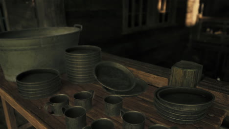 old metal kitchenware on a rustic wooden table