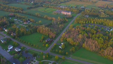 Drone-shot-LDS-Church-and-Temple-near-the-Joseph-Smith-family-farm,-frame-house,-temple,-visitors-center,-sacred-grove-in-Palmyra-New-York-Origin-locations-for-the-Mormons-and-the-book-of-Mormon