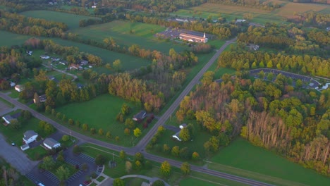drone shot lds church and temple near the joseph smith family farm, frame house, temple, visitors center, sacred grove in palmyra new york origin locations for the mormons and the book of mormon