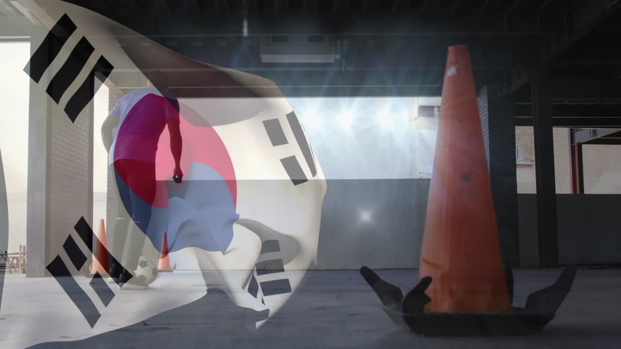 Adult male tapping ball, practicing soccer control, weaving cones as Korean flag overlay drifting