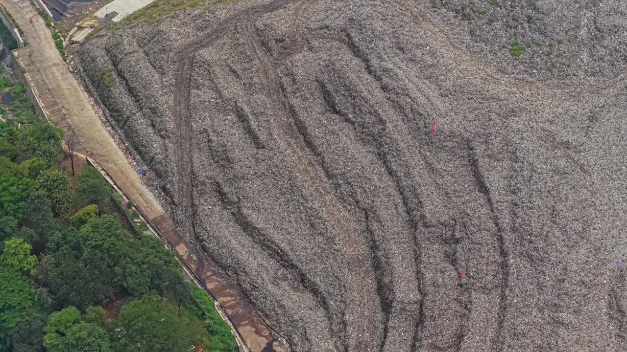 Aerial view of massive landfill mountain in jakarta