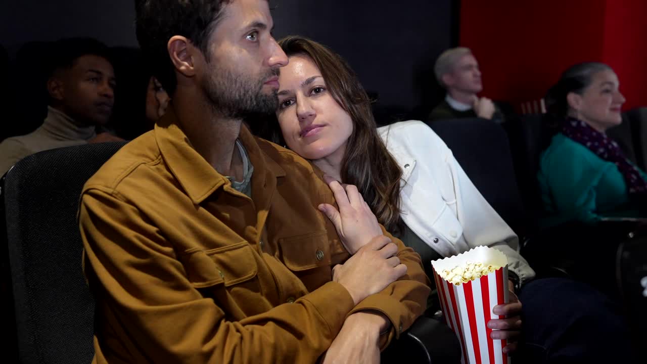 Couple Enjoying a Movie at the Theater