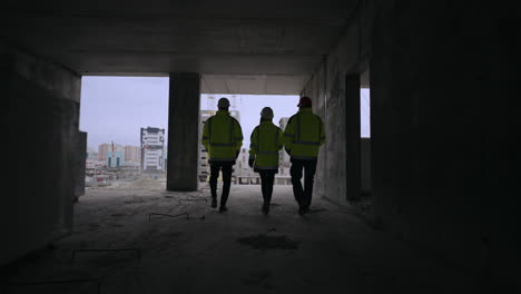 civil engineering and building construction three building inspectors are viewing construction site