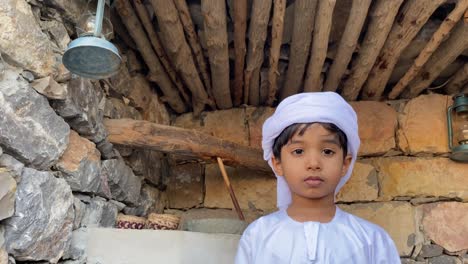 arab kid in arabian traditional house made with stone