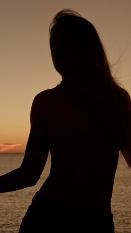 woman dancer at beach