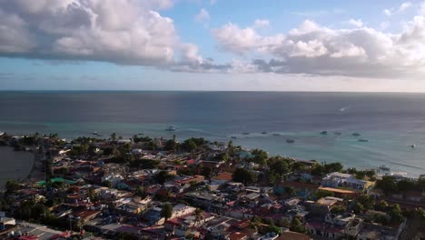 Aerial-view-picturesque-fishing-village-on-caribbean-island-at-sunset,-Los-Roques-island