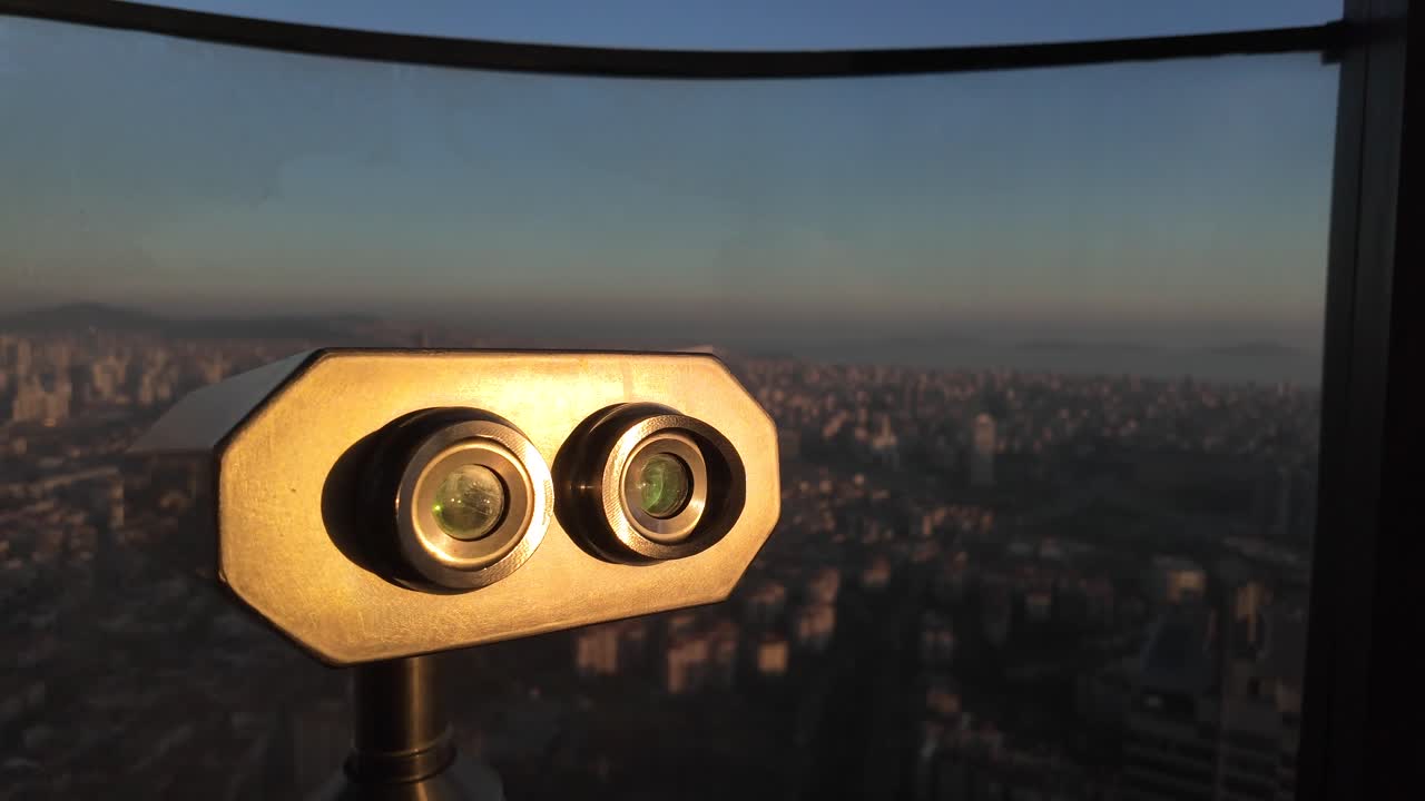 Binoculars overlooking a cityscape