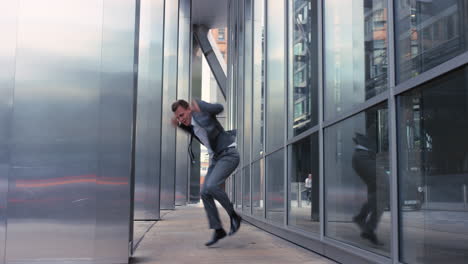 contemporary funky caucasian businessman street dancer dancing freestyle in the city